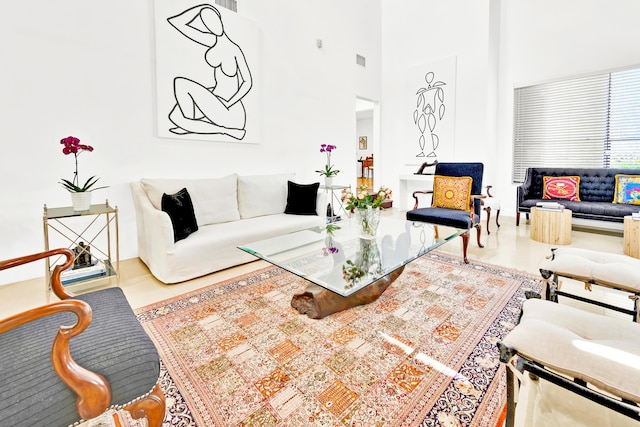 living room with a high ceiling