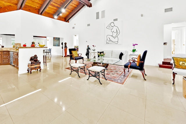 living room with high vaulted ceiling, light tile patterned floors, wood ceiling, and beam ceiling