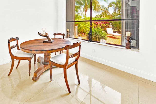 dining space with tile patterned floors