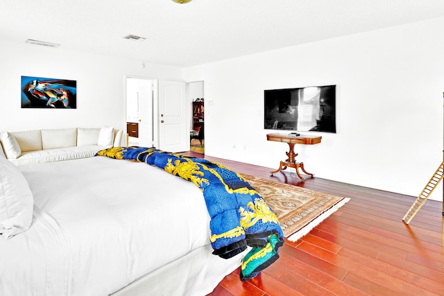 bedroom featuring hardwood / wood-style floors