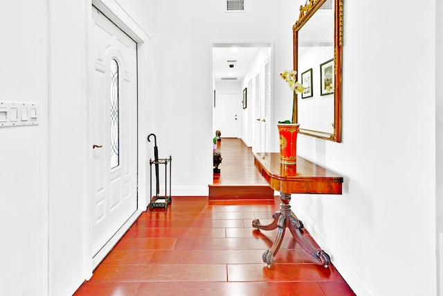 hallway with hardwood / wood-style flooring