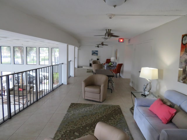 tiled living room with ceiling fan