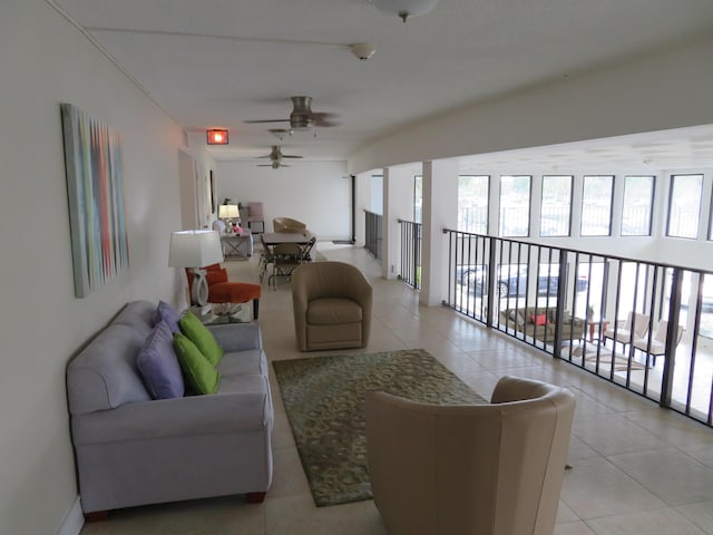 tiled living room with ceiling fan