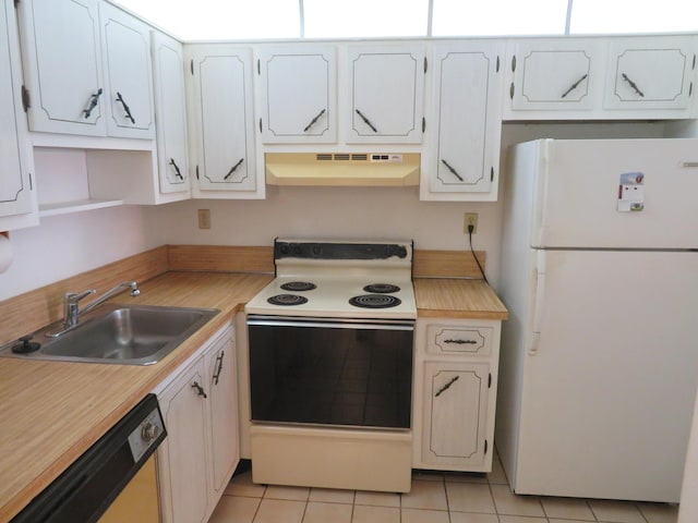 kitchen featuring white cabinetry, sink, white appliances, and light tile patterned floors