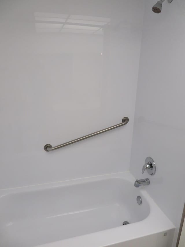 bathroom with shower / tub combination