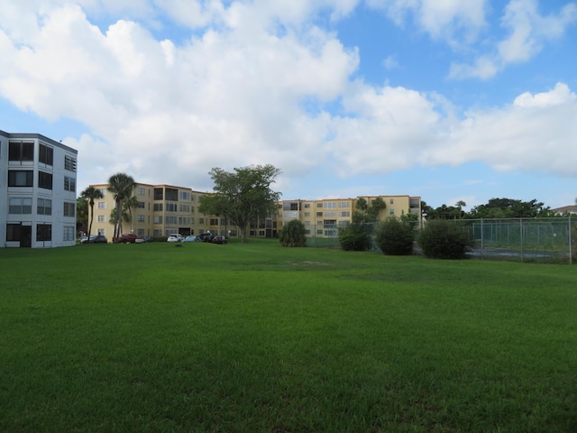 view of community featuring a yard