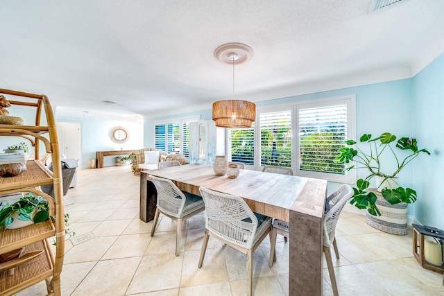 dining area with light tile patterned floors