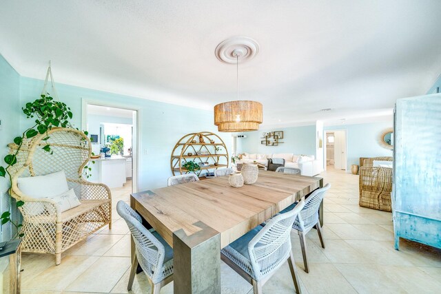 dining space with light tile patterned floors