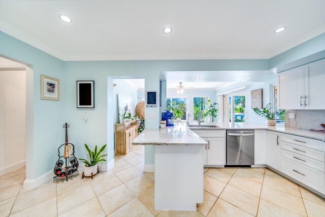 kitchen featuring light tile patterned floors, stainless steel dishwasher, light stone countertops, ceiling fan, and decorative backsplash