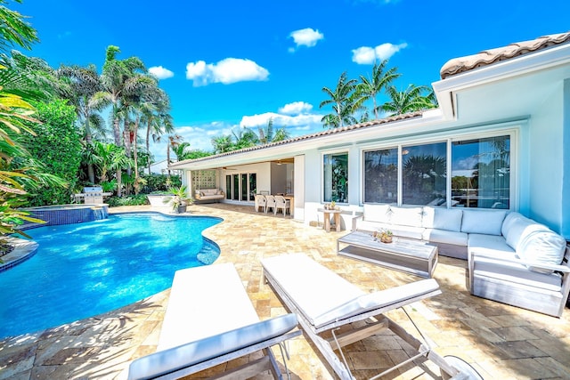 view of pool featuring a patio area and an outdoor living space