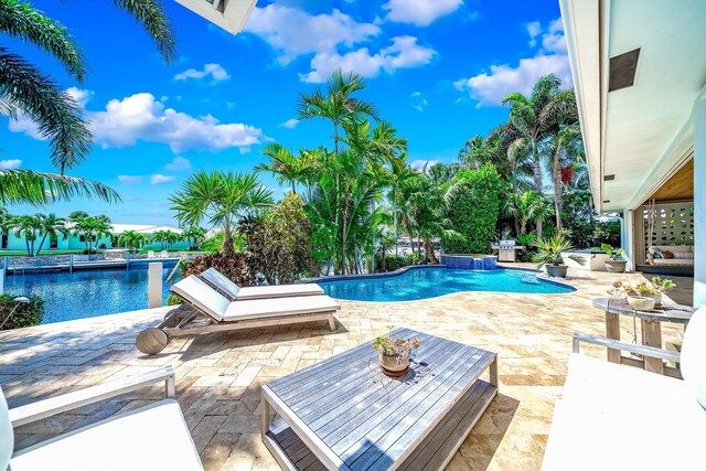 view of pool featuring a patio and pool water feature