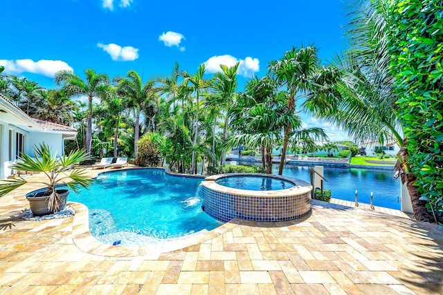 view of swimming pool featuring an in ground hot tub and a patio