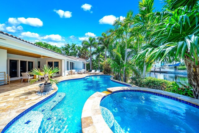 view of swimming pool with a patio