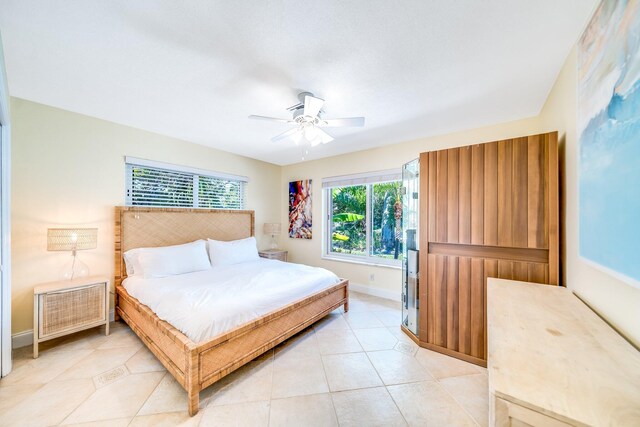 bedroom featuring ceiling fan and light tile patterned flooring