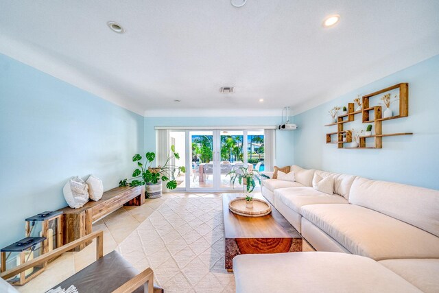 tiled living room featuring french doors