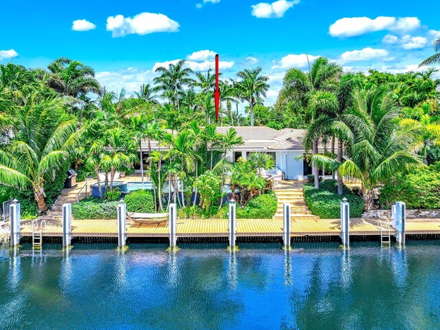 rear view of property featuring a water view