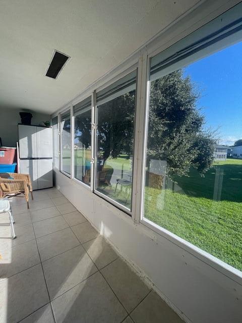 unfurnished sunroom featuring plenty of natural light