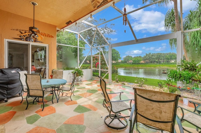 sunroom / solarium with a water view