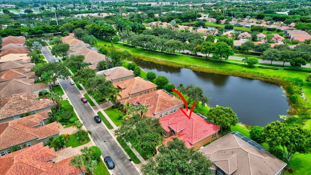 birds eye view of property featuring a water view and a residential view