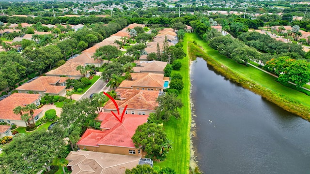 bird's eye view featuring a water view and a residential view