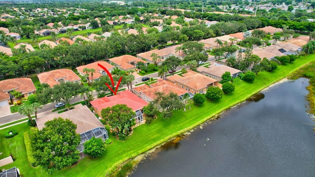 birds eye view of property featuring a residential view and a water view