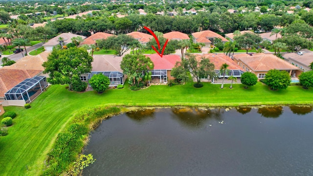 bird's eye view with a residential view and a water view