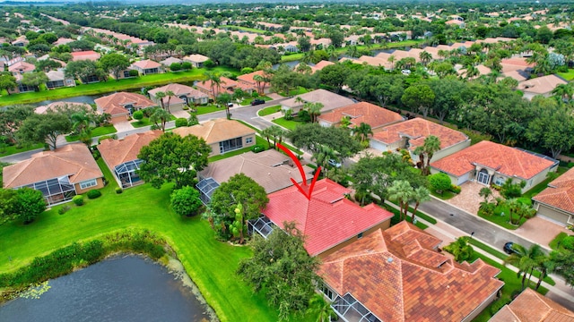 birds eye view of property with a residential view and a water view