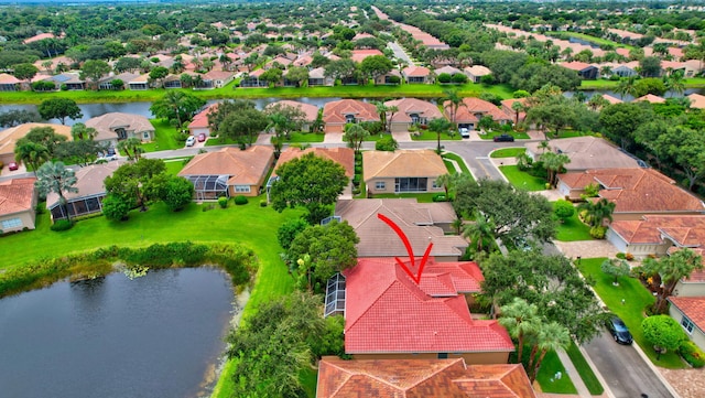 aerial view featuring a water view and a residential view