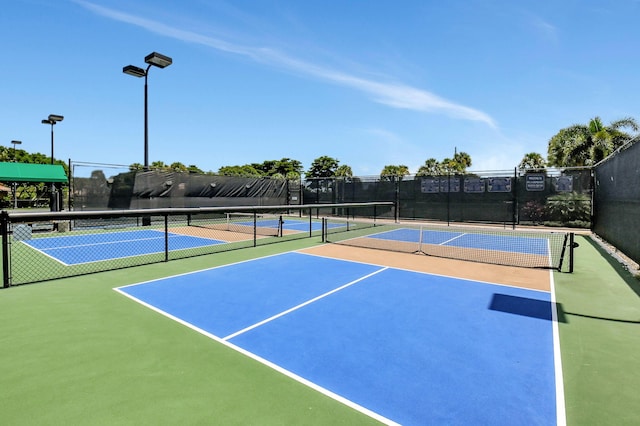 view of sport court featuring community basketball court and fence