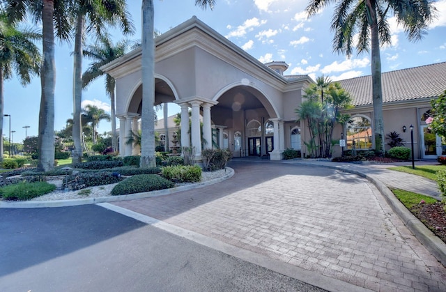 exterior space featuring decorative driveway