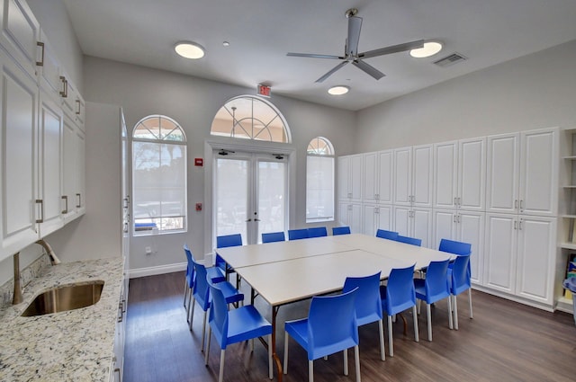 dining area featuring plenty of natural light, visible vents, dark wood-style flooring, and french doors