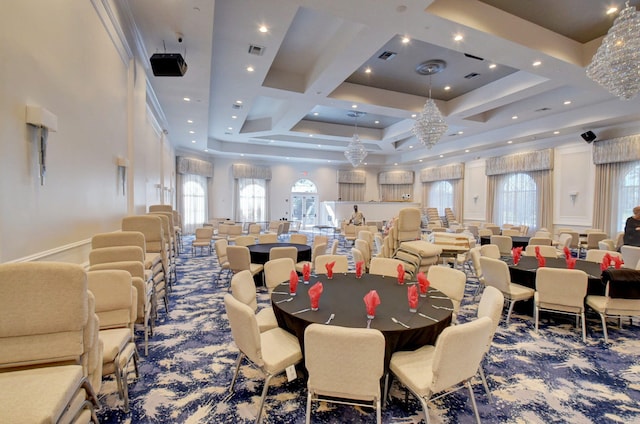 carpeted dining area featuring baseboards, coffered ceiling, visible vents, and a healthy amount of sunlight