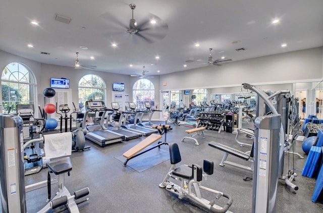 exercise room featuring visible vents, a wealth of natural light, and recessed lighting