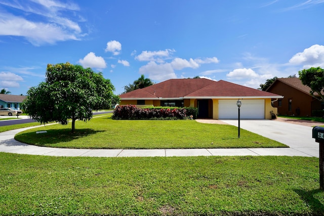 ranch-style house featuring a garage and a front lawn