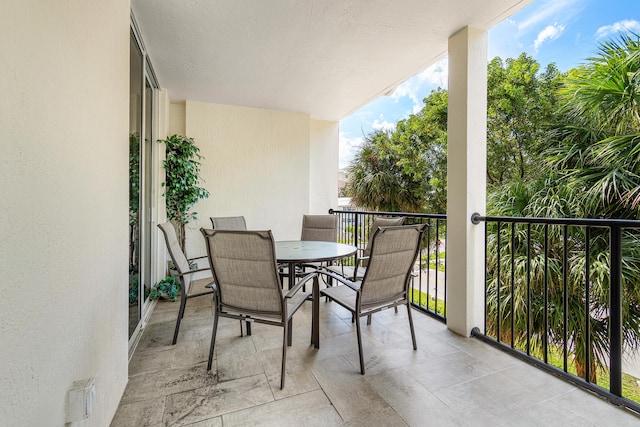 balcony with outdoor dining area