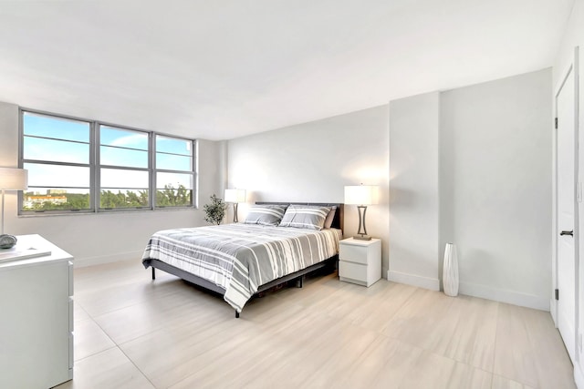 bedroom with light tile patterned flooring