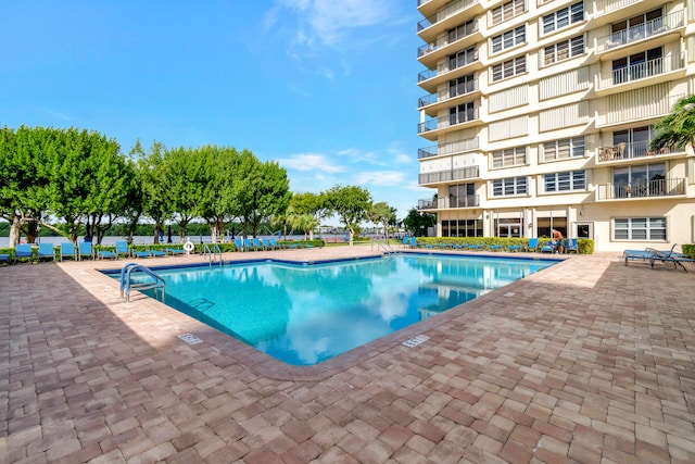 view of pool featuring a patio area