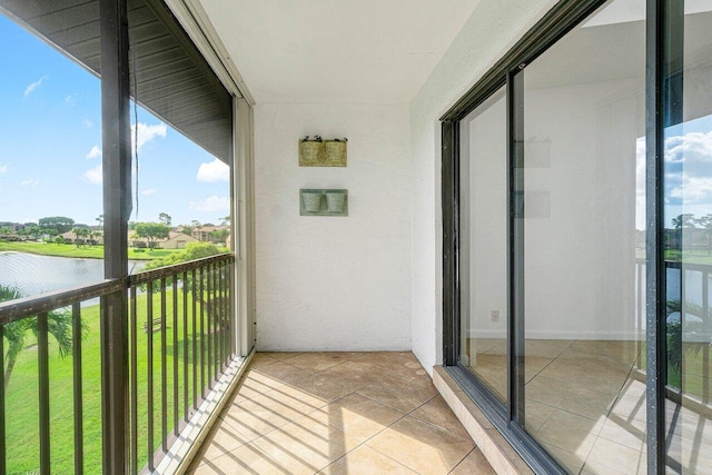 balcony featuring a water view