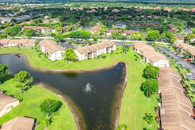 bird's eye view with a water view and a residential view