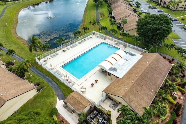 birds eye view of property with a water view