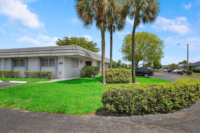 view of home's exterior with a lawn