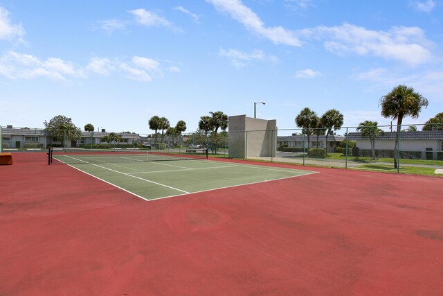 view of sport court with basketball hoop