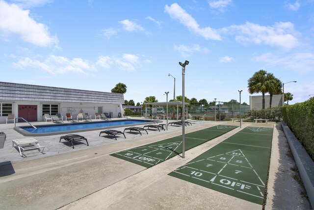 view of home's community featuring a swimming pool