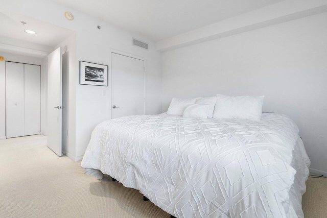 bedroom featuring light colored carpet