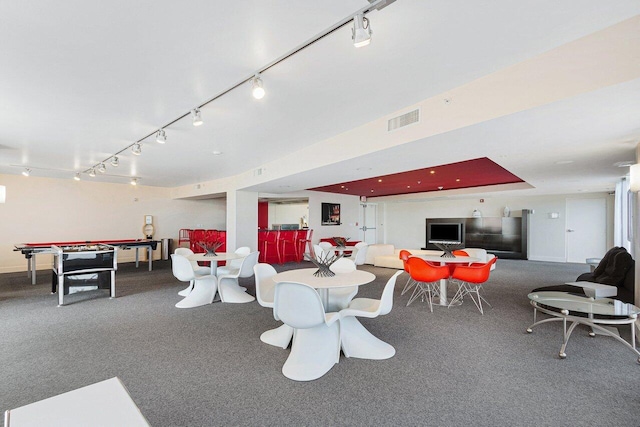 playroom with track lighting and carpet flooring