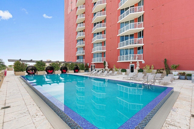 view of swimming pool with a patio