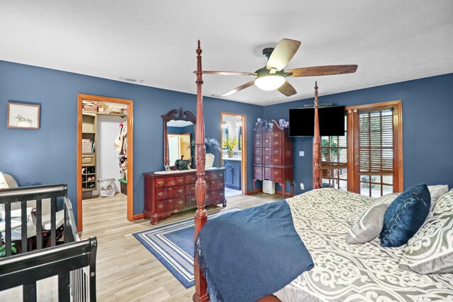 tiled bedroom featuring ceiling fan