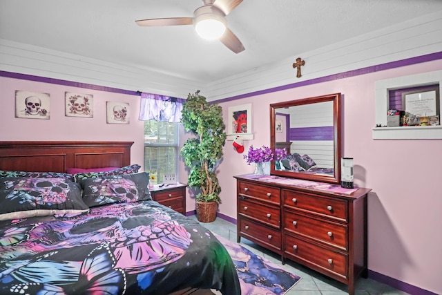 bedroom with tile patterned flooring, baseboards, and a ceiling fan