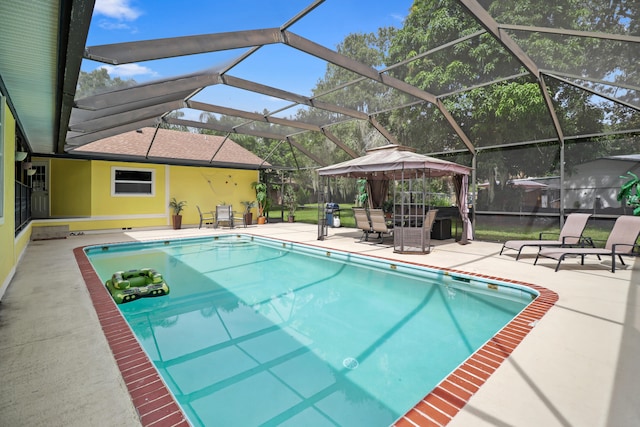 view of swimming pool featuring a patio and a lanai