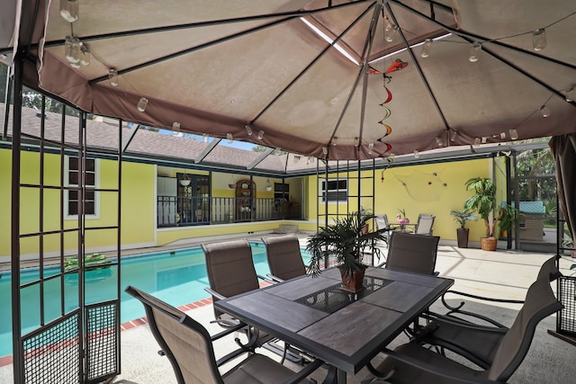 view of patio with a lanai